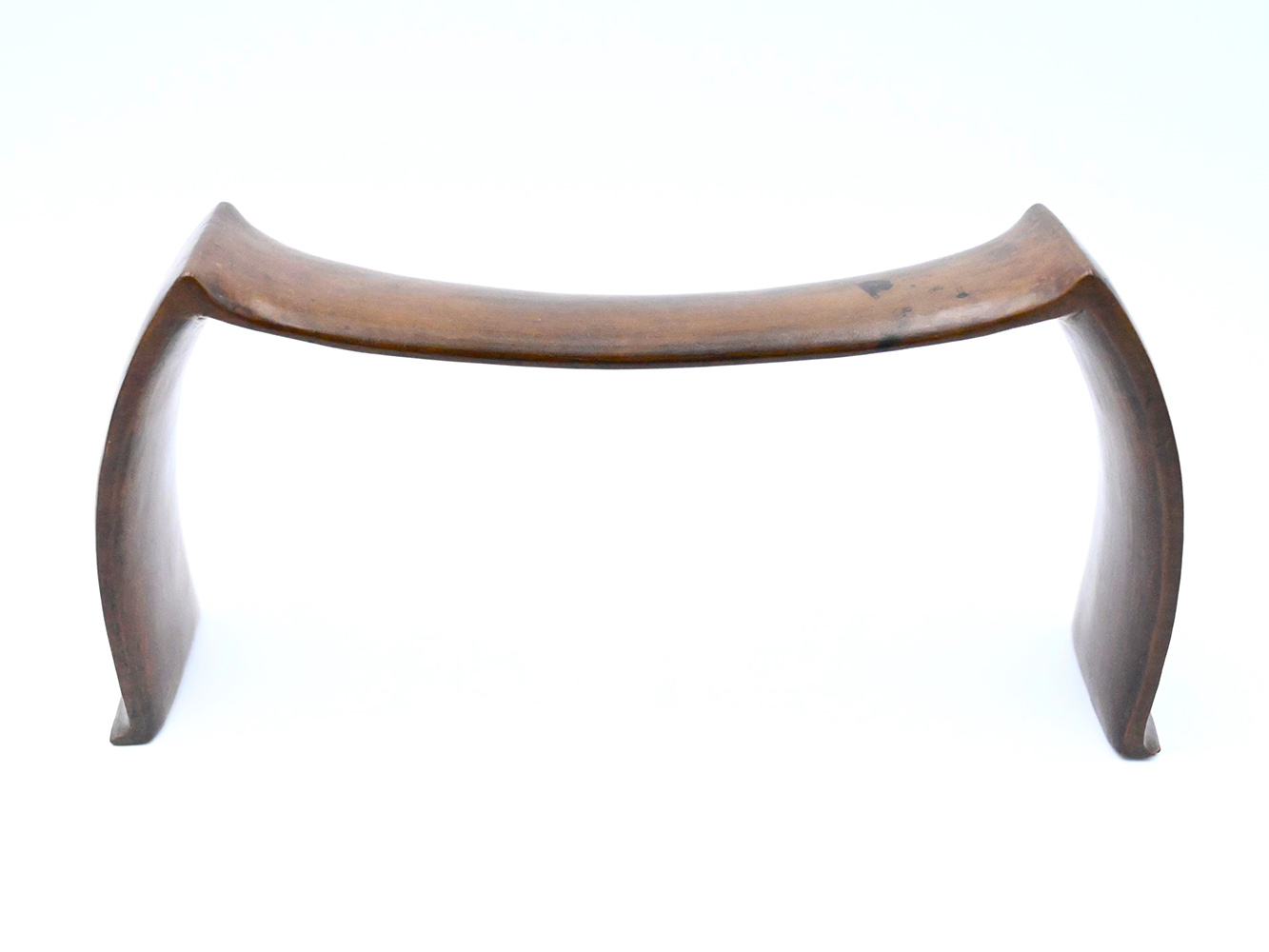 wooden headrest with smooth convex supports